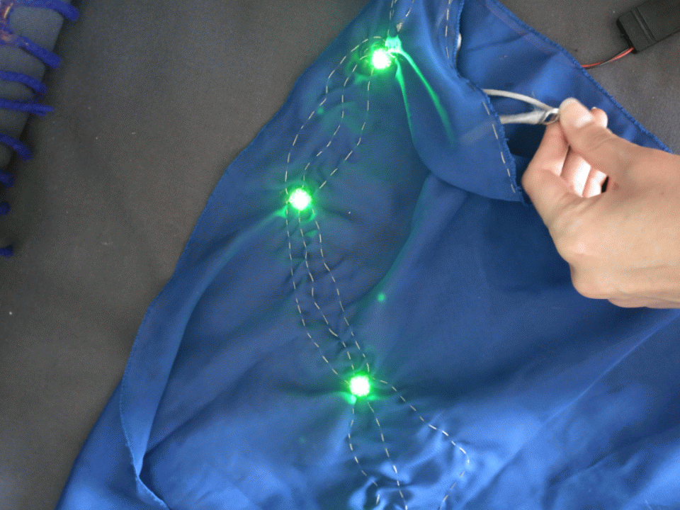 Animated gif of light changing dance costume sleeve.